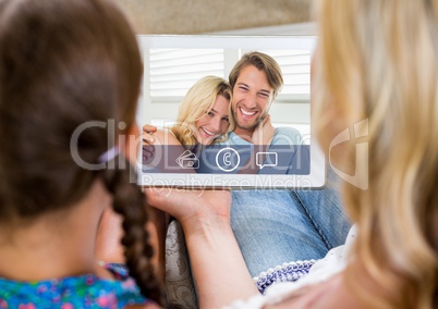Woman and girl having a video call with couple on digital tablet