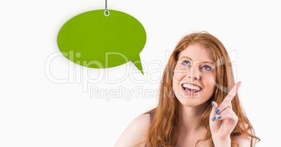 Woman pointing and looking at speech bubble icon