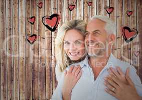 Mature romantic couple and heart graphic