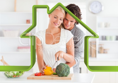 Romantic couple in kitchen against house outline in background