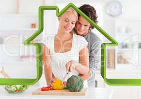 Romantic couple in kitchen against house outline in background