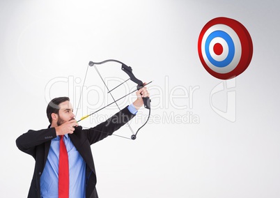 Businessman aiming at the target board against white background