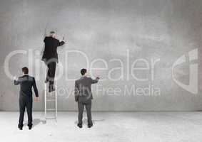 Business professionals writing against grey background