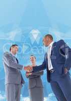 Business professionals shaking hands against abstract background
