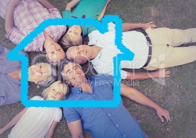 Family lying on grass overlaid with house shape