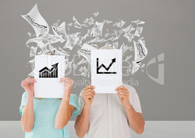 Couple holding placard with business graphics