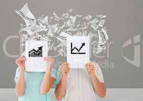 Couple holding placard with business graphics