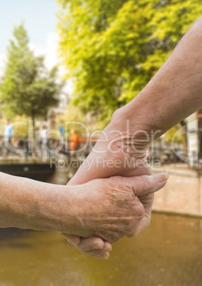 Close-up of senior couple holding hands