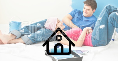 House icon with couple lying and interacting at home