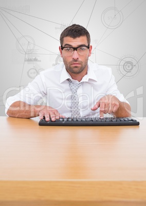 Businessman typing on keyboard at desk