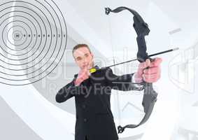 Successful businessman aiming with bow and arrow
