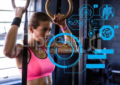 Fit woman exercising in gym with futuristic interface