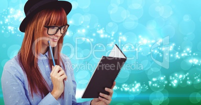 Woman reading a book against digitally generated background