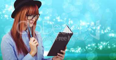Woman reading a book against digitally generated background