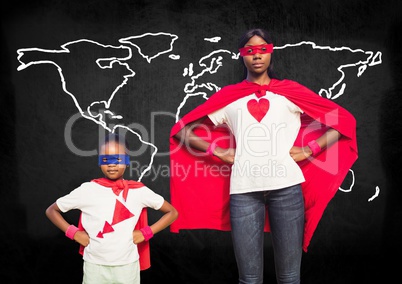 Mother and son in superhero costumes standing against world map in backround