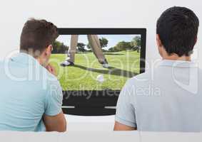 Friends watching golf on television at home