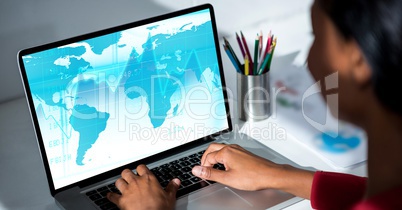 Woman working on laptop at desk