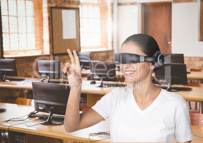 Businesswoman gesturing while using virtual reality headset in office