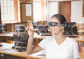 Businesswoman gesturing while using virtual reality headset in office