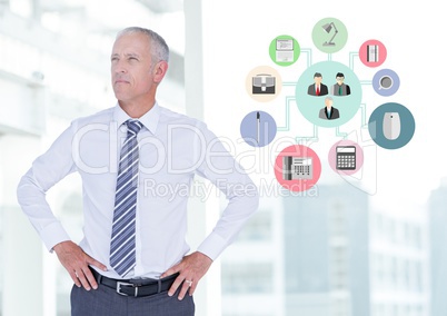 Businessman standing with hands on hips next to application icons