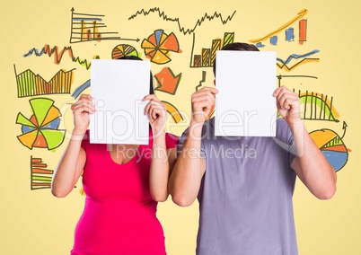 Colleagues covering their face with blank placard against business icons