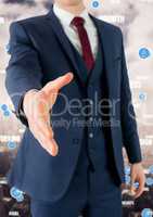 Mid section of businessman offering hand for handshake