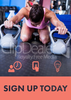 Woman exercising with kettle bells in gym