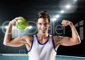 Portrait of man holding a handball and flexing muscles