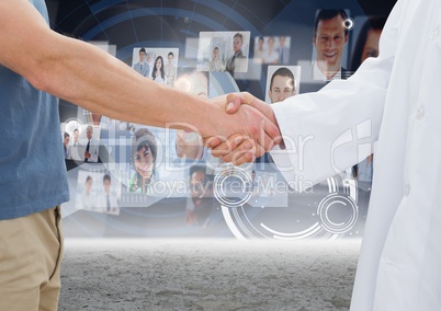 Business executives shaking hands against profile pictures in background
