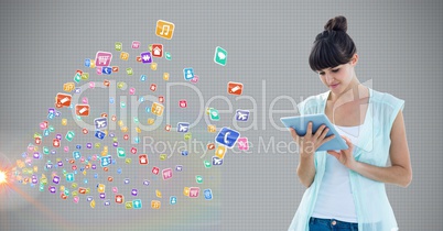 Woman using digital tablet against application icons