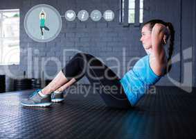 Woman performing abdominal exercise in fitness studio