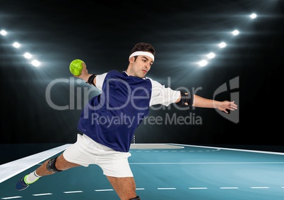 Male athlete playing handball in stadium