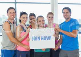 Portrait of fit peoples showing join now card
