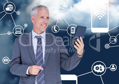 Smiling businessman holding digital tablet