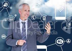 Smiling businessman holding digital tablet