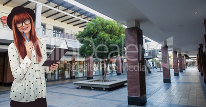 Woman with book and pen in shopping mall