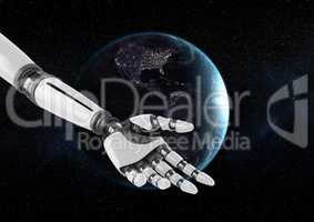 Robot hand  in front of globe against black background