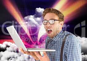 Man holding laptop against sky in background