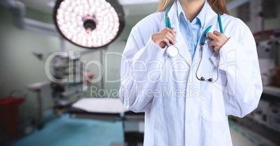 Doctor standing with stethoscope in operating room