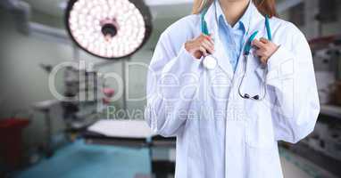Doctor standing with stethoscope in operating room