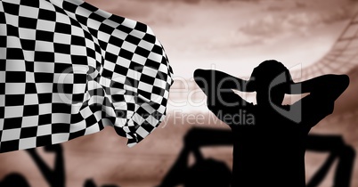 Silhouette of disappointed fan against checkered flag in background