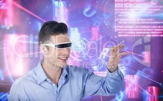 Man using virtual reality glasses against digitally generated background
