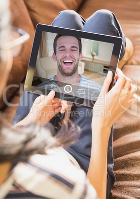 Woman having video calling on digital tablet