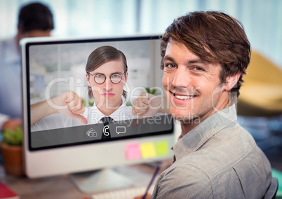 Portrait of smiling executive using computer