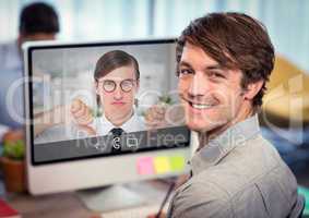Portrait of smiling executive using computer
