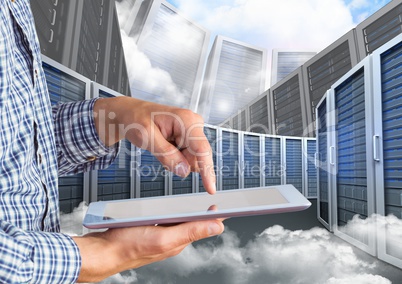 Digital composite image of businessman using digital tablet against server tower