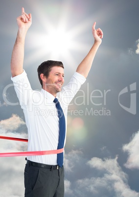 Digital composite image of a businessman winning the  race