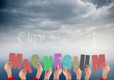 Digital composite image of hands holding magnesium cutouts