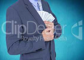Businessman putting dollar banknotes into the chest pocket