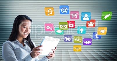 Woman using digital tablet against application icons in background